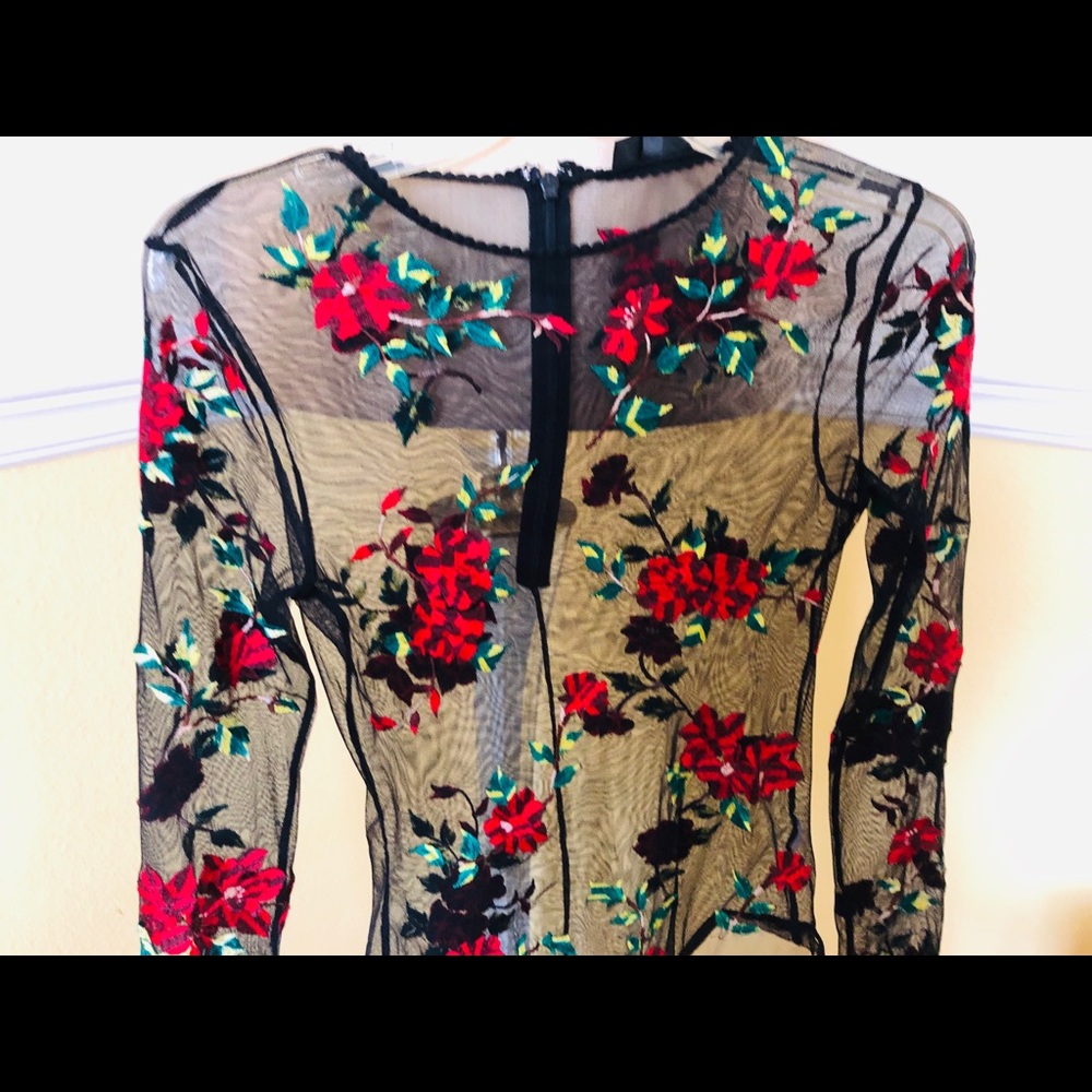 Black soft lace and embroidered body suit. Size 6.